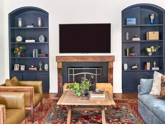 living room with blue bookshelves